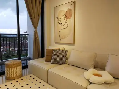 a living room with a white couch and a window at be.Cream The Cove -6mins Lost World Tambun -10pax in Ipoh