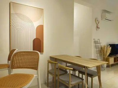 a dining room with a wooden table and chairs at be.Cream The Cove -6mins Lost World Tambun -10pax in Ipoh
