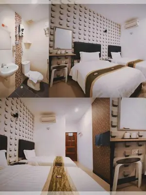 two pictures of a room with two beds and a bathroom at Inn Residence 18 in George Town