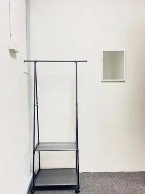 a glass display case in front of a white wall at AK Greenrise Meru in Ipoh