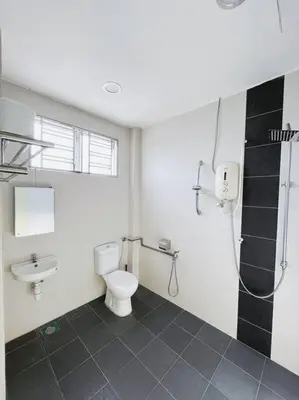 a bathroom with a toilet and a sink and a shower at KawanMu House with 6 Bedrooms in Taiping