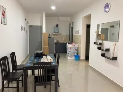 a kitchen and dining room with a table and chairs at SmileHome - Palas Horizon Residence 3R2B Apartment in Brinchang