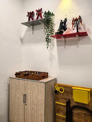 a room with a wall with shelves with scissors on it at Ocean Private Pool Homestay Ipoh \u6d77\u6d0b\u98ce\u60c5\u6cf3\u6c60\u6c11\u5bbf 14px\uff08Wellsonhome\uff09 in Ipoh