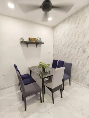 a dining room with a table and blue chairs at Ocean Private Pool Homestay Ipoh \u6d77\u6d0b\u98ce\u60c5\u6cf3\u6c60\u6c11\u5bbf 14px\uff08Wellsonhome\uff09 in Ipoh