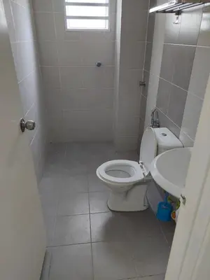 a bathroom with a toilet and a sink at 3 Bedroom Apartment with Pool and Beautiful View in Klebang, Ipoh in Chemor