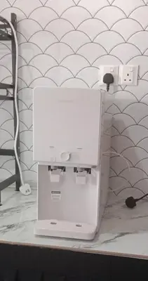 a white wii machine sitting on a counter at D'Haty Homestay in Padang Serai