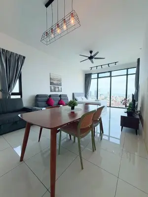 a living room with a dining room table and a couch at Beacon Executive Suite by Uptrend Home Management in George Town