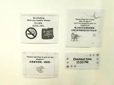 a group of signs on a wall at Calm in Kuala Kubu Bharu in Kuala Kubu Baharu