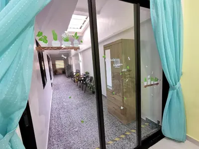 a corridor of an office with blue curtains at Calm in Kuala Kubu Bharu in Kuala Kubu Baharu