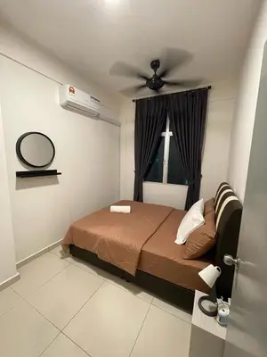 a bedroom with a bed and a ceiling fan at Meru Ipoh Residence Wifi+Pool (Muslim) in Bandar Meru Raya