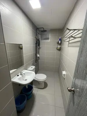 a small bathroom with a toilet and a sink at Meru Ipoh Residence Wifi+Pool (Muslim) in Bandar Meru Raya