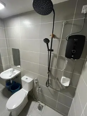 a bathroom with a shower with a toilet and a shower at Meru Ipoh Residence Wifi+Pool (Muslim) in Bandar Meru Raya