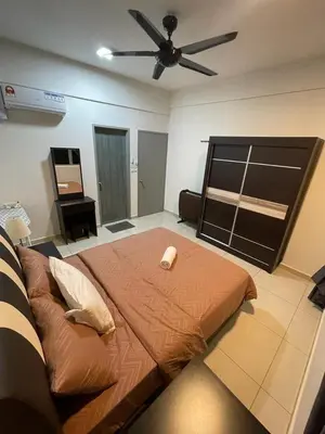 a bedroom with a bed and a ceiling fan at Meru Ipoh Residence Wifi+Pool (Muslim) in Bandar Meru Raya