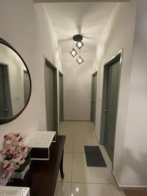 a hallway with a mirror and a table and a mirror at Meru Ipoh Residence Wifi+Pool (Muslim) in Bandar Meru Raya