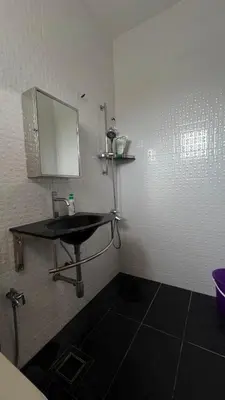 a bathroom with a sink and a mirror on the wall at 515 Nana’s Homes in Sekinchan in Sekincan