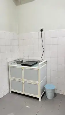 a kitchen with a counter top with aperature at 515 Nana’s Homes in Sekinchan in Sekincan