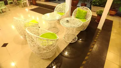 a group of white wine glasses sitting on a counter at Apple 1 Hotel Gurney in George Town