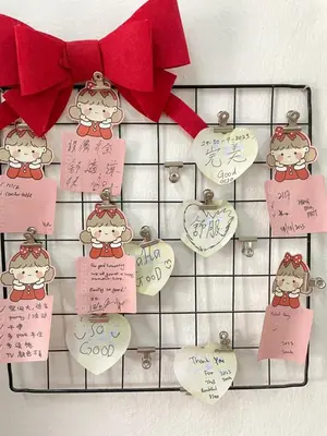 a bunch of tags on a rack with hearts at Happy Gather Homestay \u6b22\u805a\u9601 in Ipoh