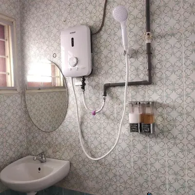 a shower in a bathroom with a sink at HAPPY GATHER HOMESTAY in Ipoh