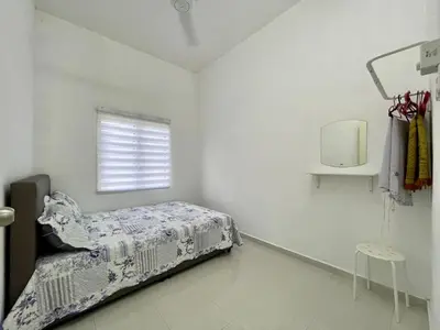 a white bedroom with a bed and a window at Rumah Kami Homestay in Butterworth