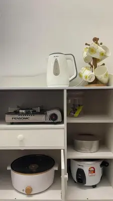 a shelf with a blender and other items on it at Rumah Kami Homestay in Butterworth