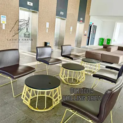 a lobby with chairs and tables in a waiting room at Urban Suites 2BR #SelfCheck-in #6Pax #TopFacilities in Jelutong