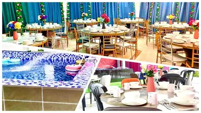 a dining room with tables and a swimming pool at Penang Dream Banglo Sleeps 28 in Tanjung Bungah