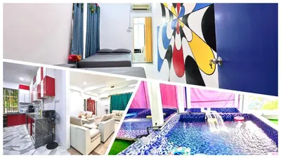 a living room with a swimming pool in a house at Penang Dream Banglo Sleeps 50 in Tanjung Bungah