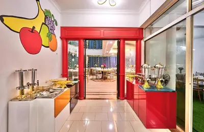 a restaurant with a counter with apples on the wall at Penang Dream Banglo Events up to 120 Pax in Tanjung Bungah