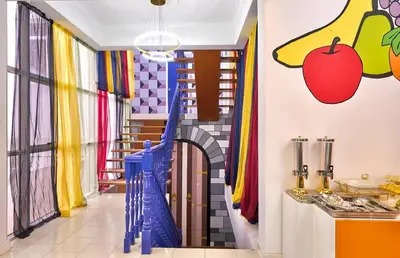 a room with a hallway with colorful walls at Penang Dream Banglo Sleeps 22 in Tanjung Bungah