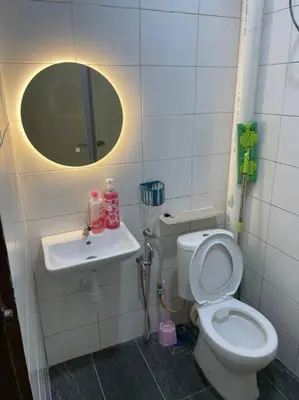a bathroom with a toilet and a sink at SunShine HomeStay in Bukit Mertajam