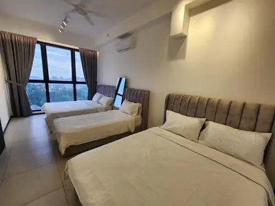 a hotel room with two beds and a window at Urban Suites - Penang in Jelutong