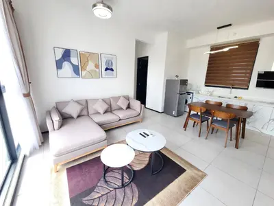 a living room with a couch and a table at Urban Suites - Penang in Jelutong