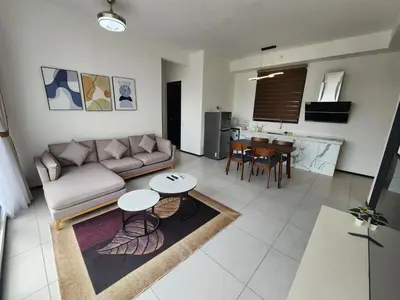 a living room with a couch and a table at Urban Suites - Penang in Jelutong