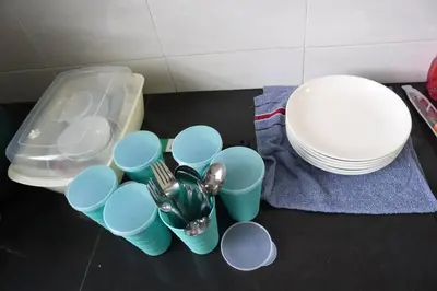 a group of cups and plates on the floor at Green Space Homestay Cozy Family(8-12pax) in Ipoh