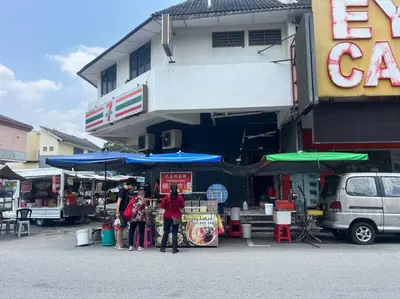 a group of people standing in front of a building at Green Space Homestay Cozy Family(8-12pax) in Ipoh