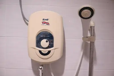 a soap dispenser on a wall in a bathroom at Green Space Homestay Cozy Family(8-12pax) in Ipoh