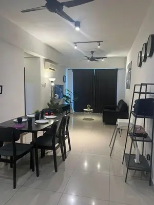 a living room with a table and chairs and a couch at Ipoh Town Majestic 3R2B 10paxs Remi Suite in Ipoh