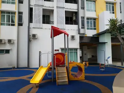 a playground with a slide in front of a building at Ipoh Town Majestic 3R2B 10paxs Remi Suite in Ipoh