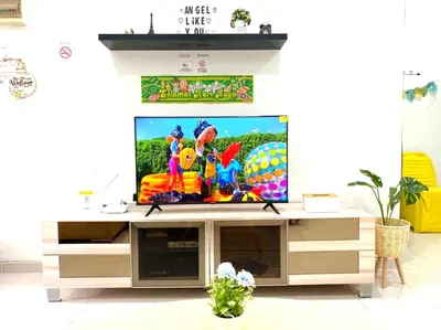 a television on a stand in a living room at Bidor Family Choice 3 Bedrooms WIFI in Bidur