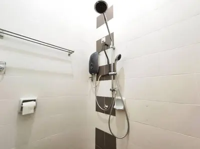 a shower in a bathroom with a phone on the wall at Bidor Family Choice 3 Bedrooms WIFI in Bidur