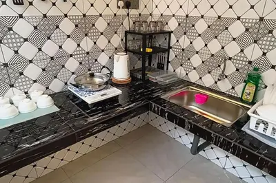 a kitchen with a sink and a counter top at Wi-Fi 100MB free Ipoh Homefeel 4 rooms Tatami S48 in Ipoh