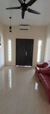 a living room with a couch and a ceiling fan at Wi-Fi 100MB free Ipoh Homefeel 4 rooms Tatami S48 in Ipoh