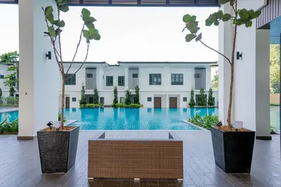 a courtyard with a swimming pool in a building at Ipoh Tambun Sunway Onsen Suite 3R2B Miya in Ipoh