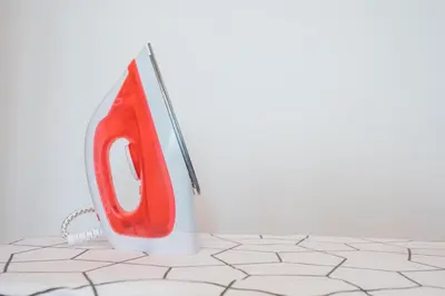 a red and white phone sitting on a tile floor at Ipoh Tambun Sunway Onsen Suite 3R2B Maya in Tambun