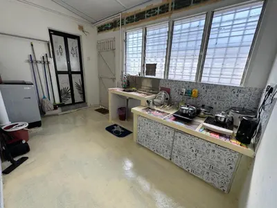 a kitchen with a counter and some windows at Wi-Fi 100MB free Ipoh Town Holiday House Tmn Shatin S36 in Ipoh