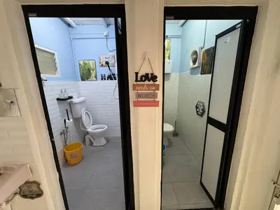a bathroom with a toilet and a sign that says love at Wi-Fi 100MB free Ipoh Town Holiday House Tmn Shatin S36 in Ipoh