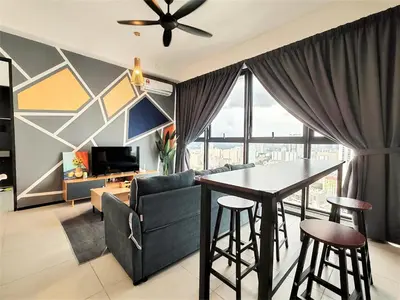 a living room with a couch and a table at Cozy Minimalist Suite at Urban Suites Georgetown by SuperStay in Jelutong