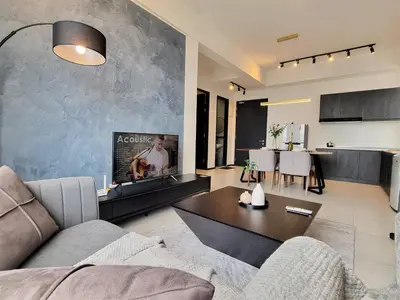 a living room with a couch and a table at Cozy Minimalist Suite at Urban Suites Georgetown by SuperStay in Jelutong