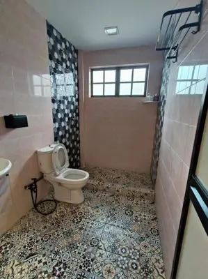 a bathroom with a toilet and a sink and a shower at (WI-FI) Ipoh Holiday Big House double storey DR8 in Ipoh